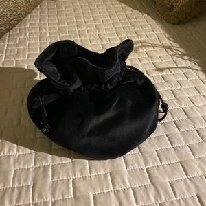 Talbot’s black drawstring wristlet.